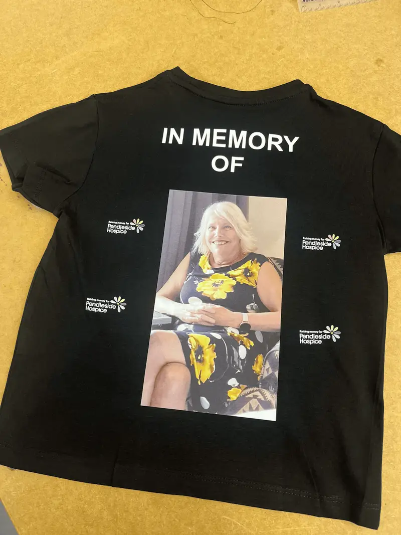 Black memorial t-shirt printed with a photograph and Pendleside Hospice logos