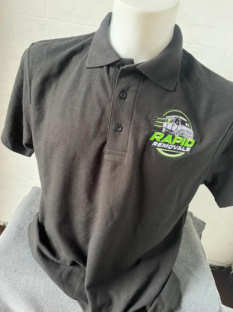 Black Rapid Removals polo shirt on a mannequin