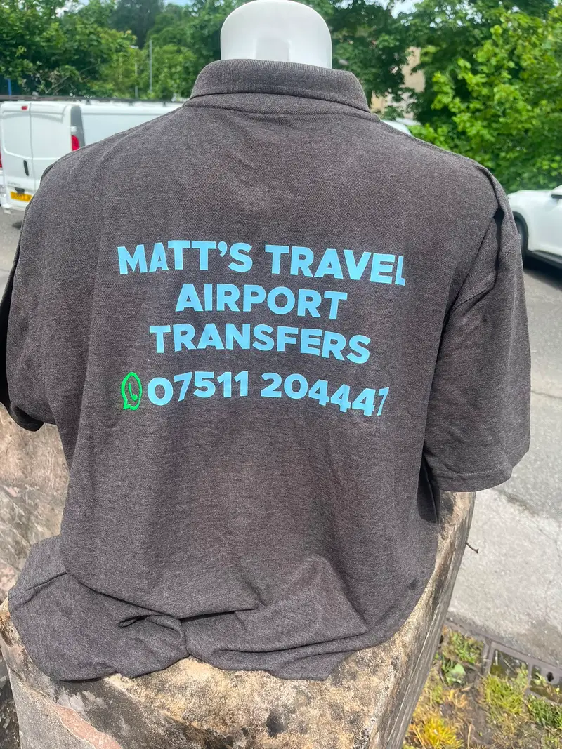 Brown polo printed with Matt's Travel Airport Transfers and phone number