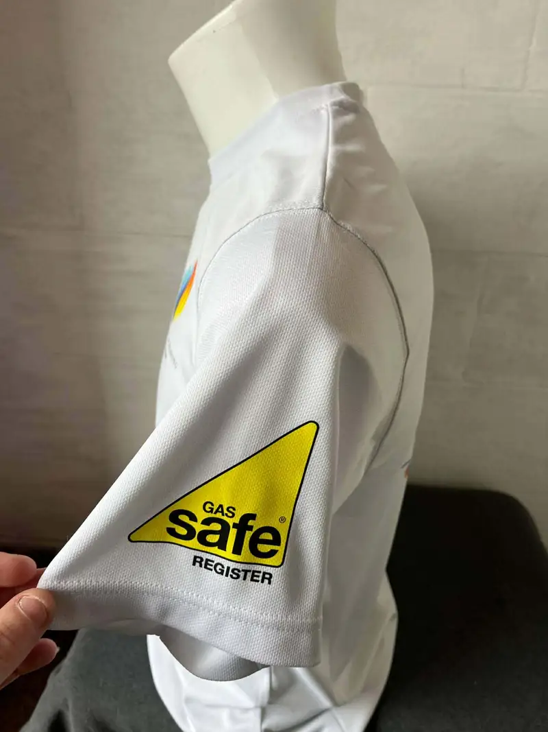 Gas Safe Register logo printed on the sleeve of a white work shirt