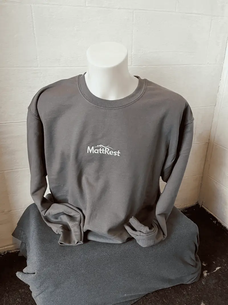 Grey sweatshirt with the MattRest logo embroidered small on the centre chest