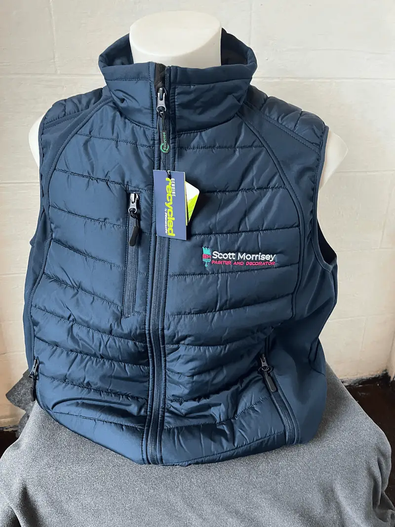 Navy gilet embroidered with the Scott Morrisey painter and decorator logo