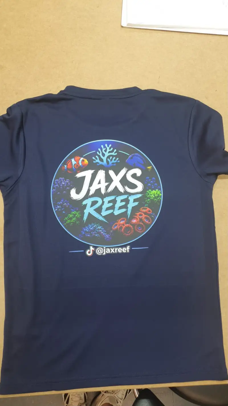 Navy t-shirt printed in Colne with the full-colour Jaxs Reef aquarium logo across the back