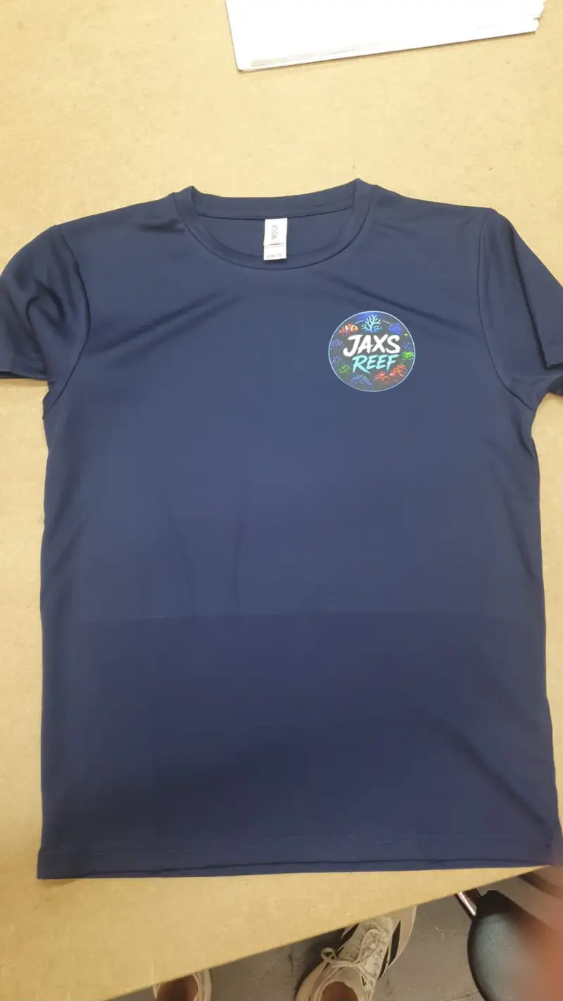 Navy t-shirt with small printed Jaxs Reef logo on the left chest
