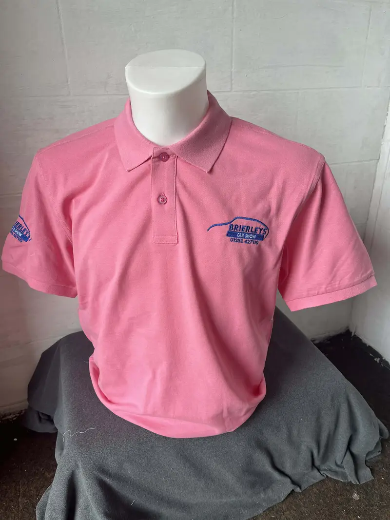 Pink polo shirt embroidered on the chest and sleeve with the Brierleys Car Show logo