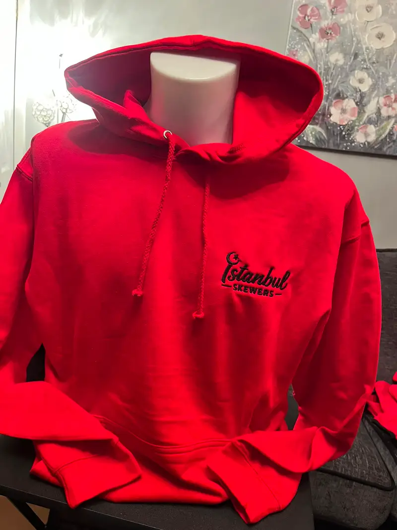Red hoodie embroidered with the Istanbul Skewers logo on the chest